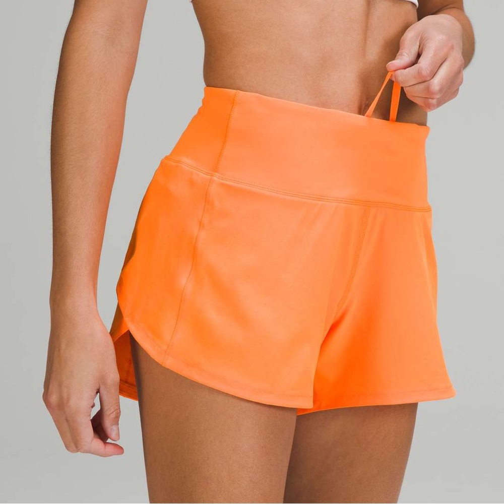 lululemon size 0, 2.5 inch speed up shorts in orange soda